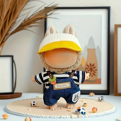 Toy figure with a yellow cap and striped shirt on a decorative surface