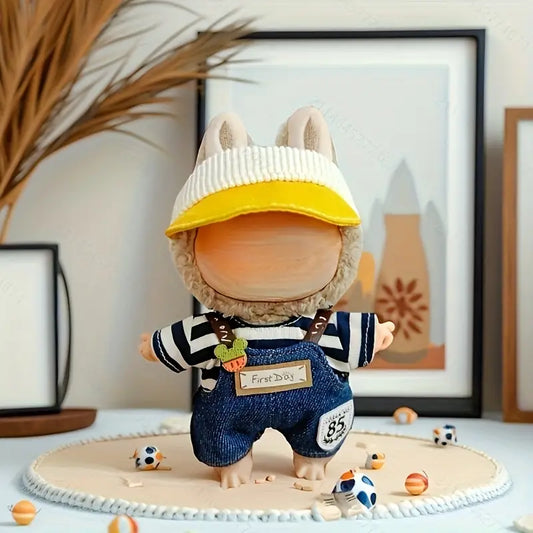 Toy figure with a yellow cap and striped shirt on a decorative surface