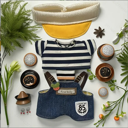 Labubu's outfit with striped shirt, overalls, and visor on a white background with decorative elements.