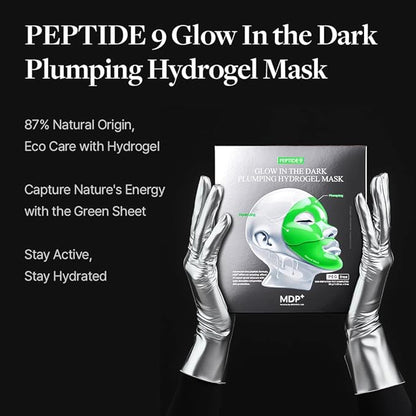 PEPTIDE 9 Glow In the Dark Plumping Hydrogel Mask packaging with hands wearing silver gloves on a black background.
