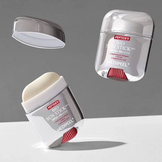 Two Medipeel Bio Skin Stick products on a gray background