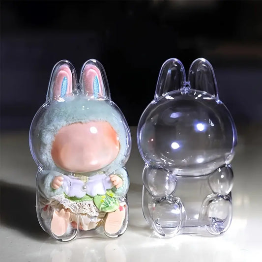 Close-up of a Zibuya bunny-shaped clear acrylic display case showing one case holding a Labubu plush doll and another empty case beside it.