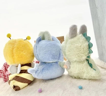 Adorable Labubu figure dressed in soft green dinosaur clothing by Zibuya.
