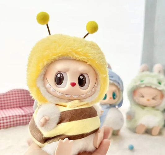 Close-up of Labubu plushie wearing fuzzy yellow bee costume with antennas, kawaii doll outfit for 20cm streetwear plush collectors from Zibuya